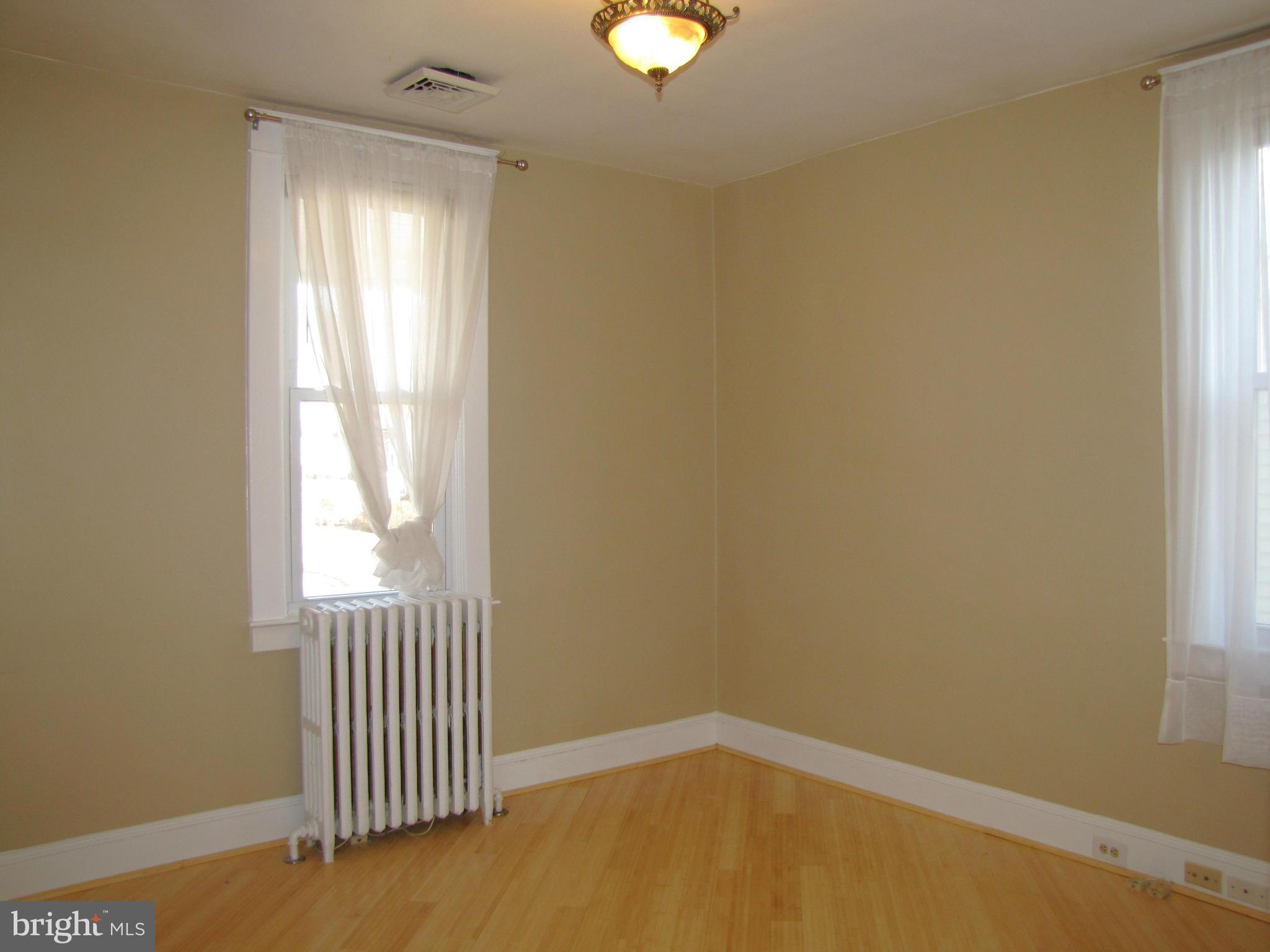 41 Edmondson Ridge Road Baltimore, MD 21228 - Photo 14 of 30 an empty room with windows