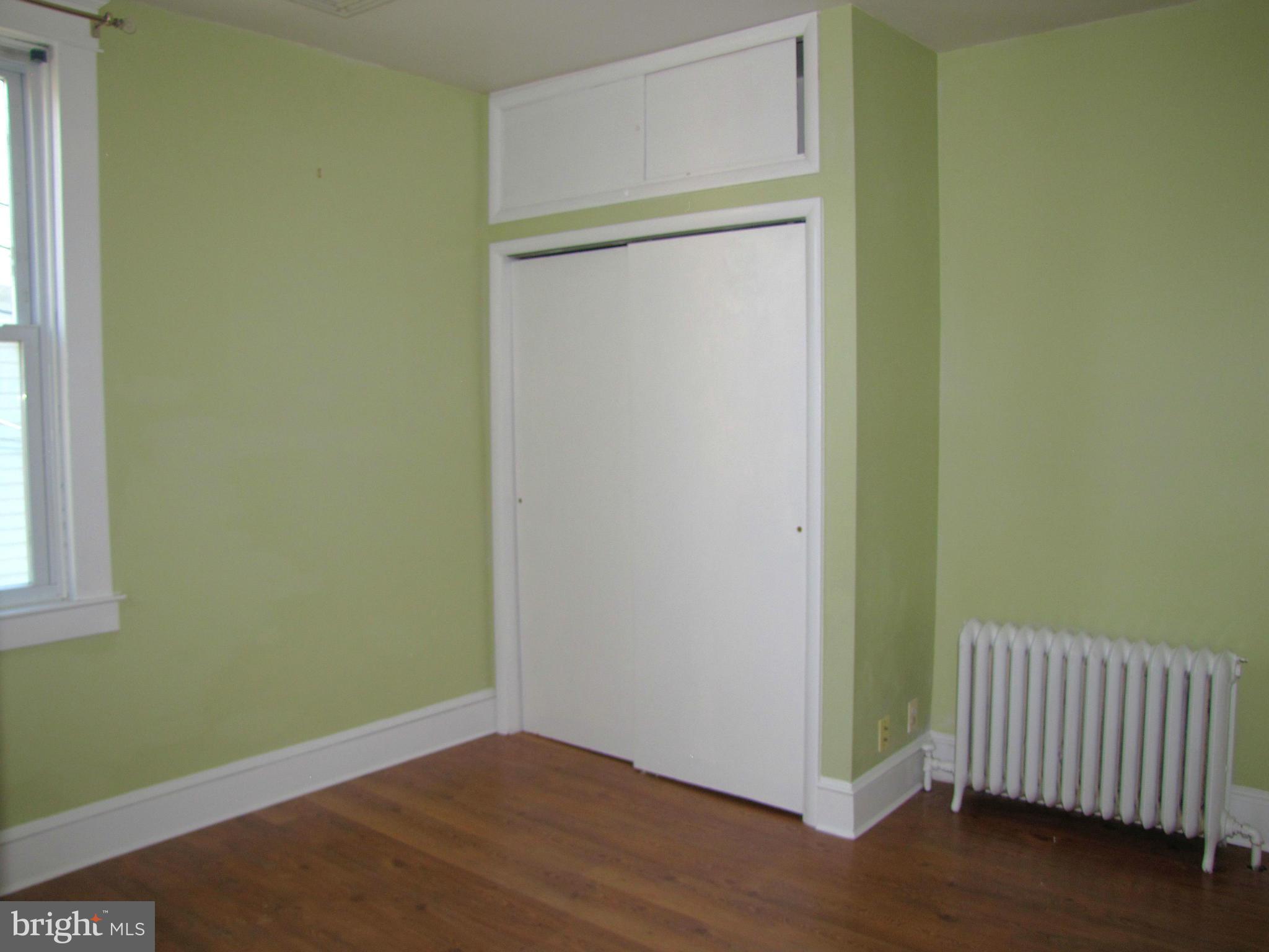 41 Edmondson Ridge Road Baltimore, MD 21228 - Photo 18 of 30 a view of a room with wooden floor and a window