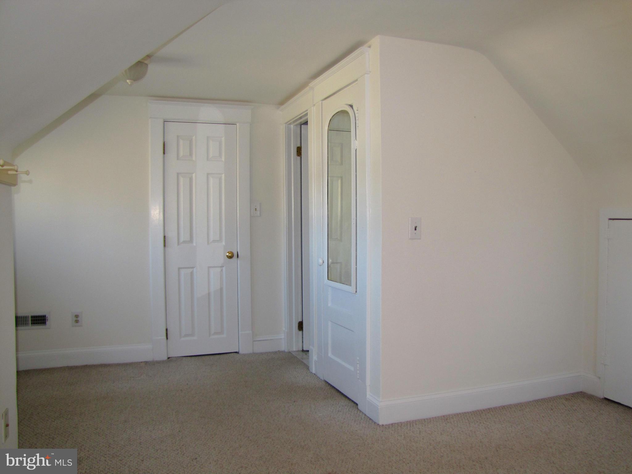 41 Edmondson Ridge Road Baltimore, MD 21228 - Photo 23 of 30 an empty room with windows