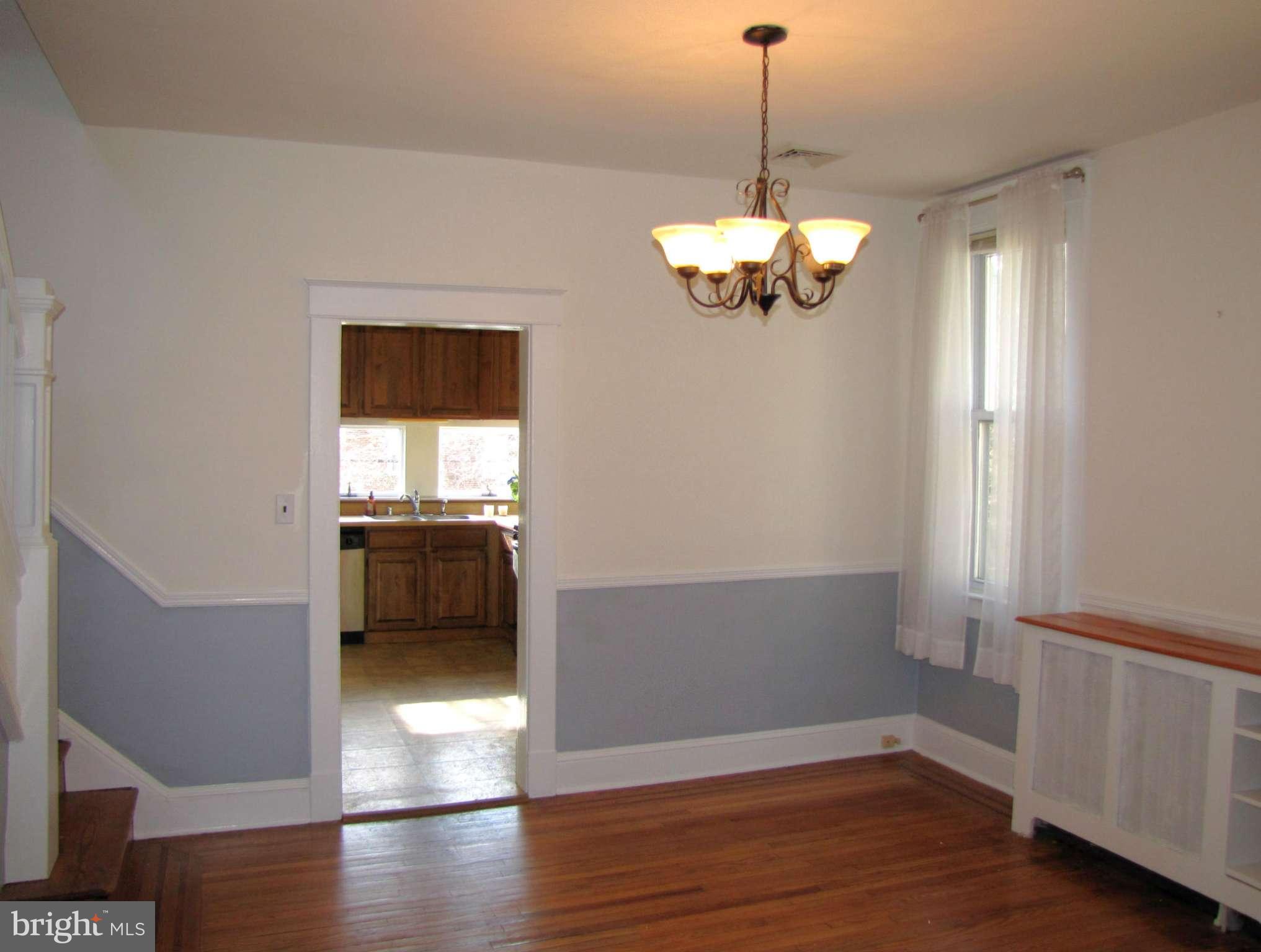 41 Edmondson Ridge Road Baltimore, MD 21228 - Photo 5 of 30 a view of a room with wooden floor chandelier and a window
