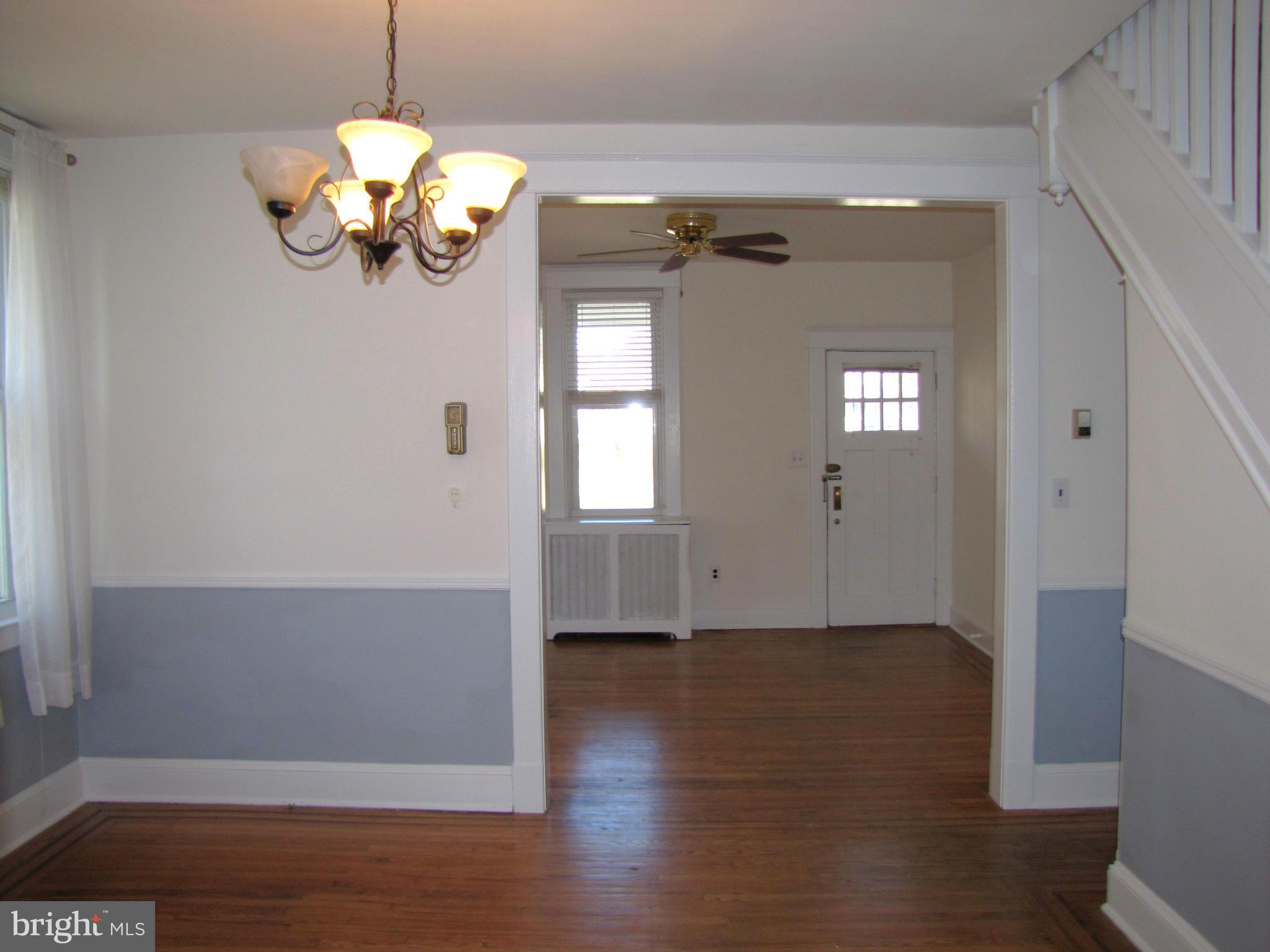 41 Edmondson Ridge Road Baltimore, MD 21228 - Photo 8 of 30 a view of a room with wooden floor chandelier and closet