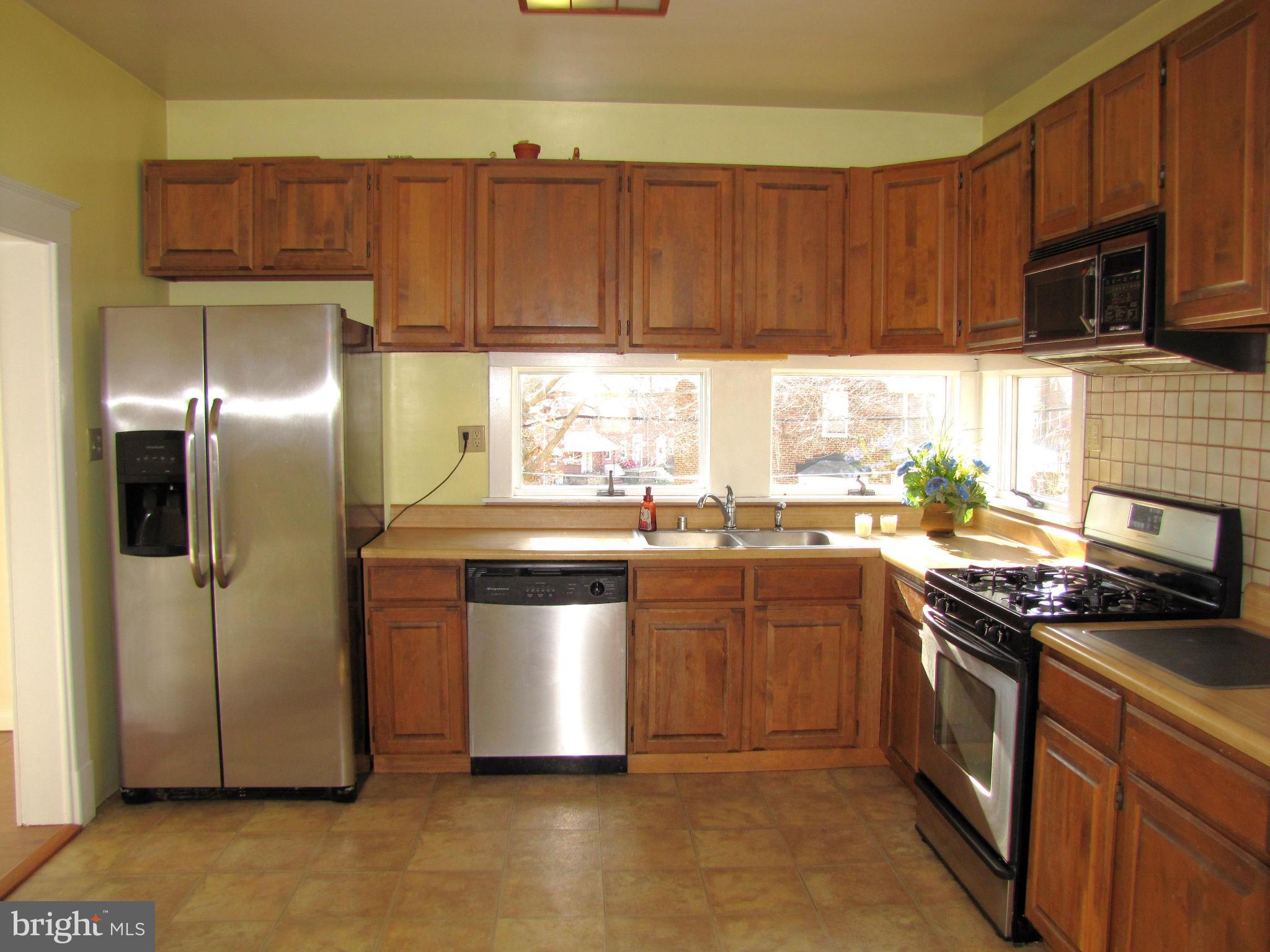 41 Edmondson Ridge Road Baltimore, MD 21228 - Photo 9 of 30 a kitchen with stainless steel appliances granite countertop a stove a refrigerator and a sink