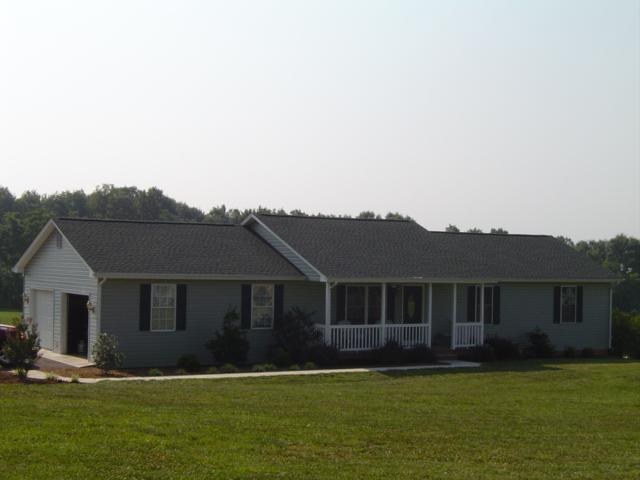26 Cardinal Ridge Drive Rocky Mount, VA 24151 - Photo 1 of 1 a front view of a house with a garden and yard