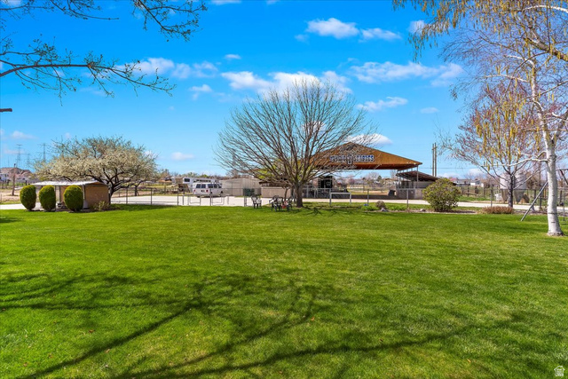 5321 South 3100th Street West Roy, UT 84067 - Photo 10 of 64 Expansive green lawn with mature trees