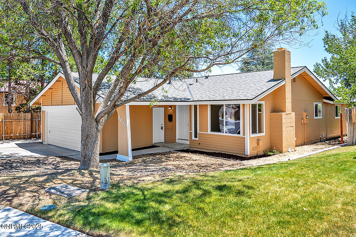 3670 Meeks Way Reno, NV 89503 - Photo 1 of 21 a view of a house with a yard
