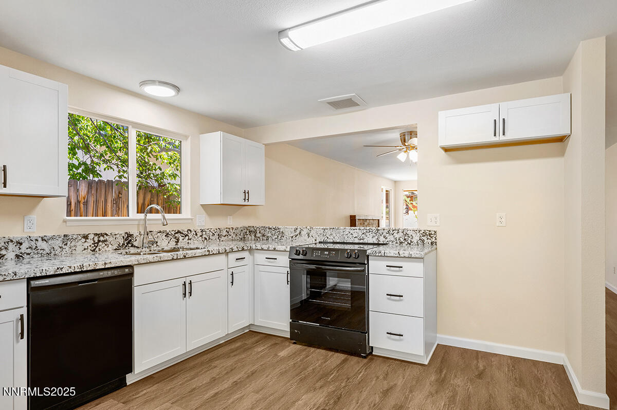 3670 Meeks Way Reno, NV 89503 - Photo 8 of 21 a kitchen with a stove top oven sink and cabinets