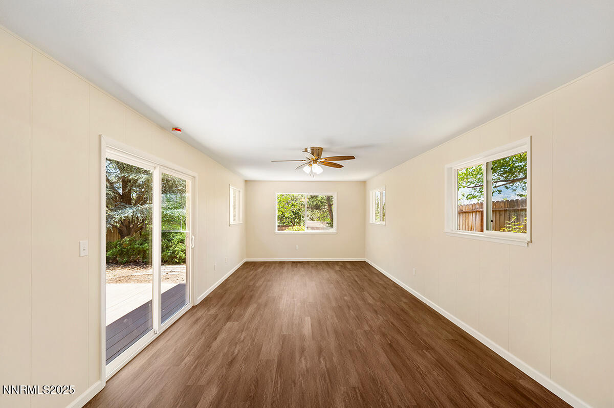 3670 Meeks Way Reno, NV 89503 - Photo 9 of 21 an empty room with wooden floor and windows
