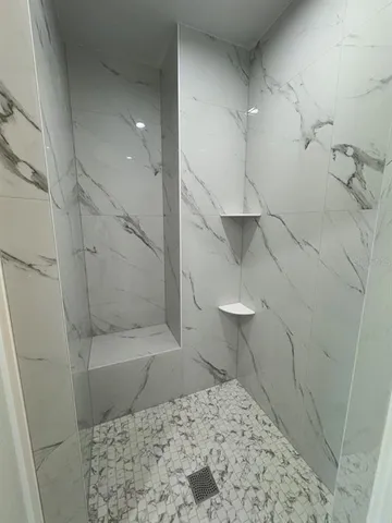a bathroom with a sink and a shower