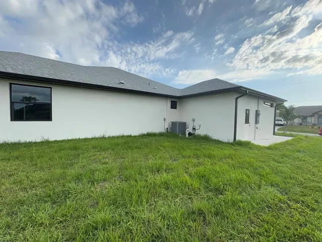 a backyard of a house with lots of green space