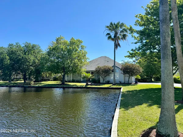 a view of a lake with a house