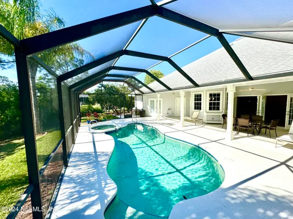 a view of swimming pool with a patio