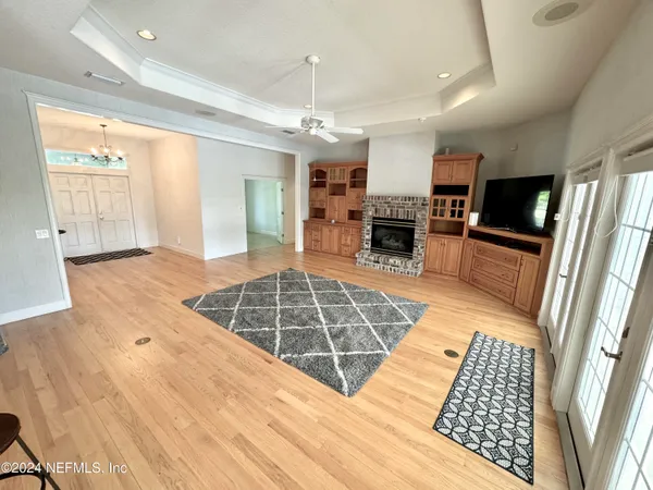 a view of kitchen with furniture oven and window
