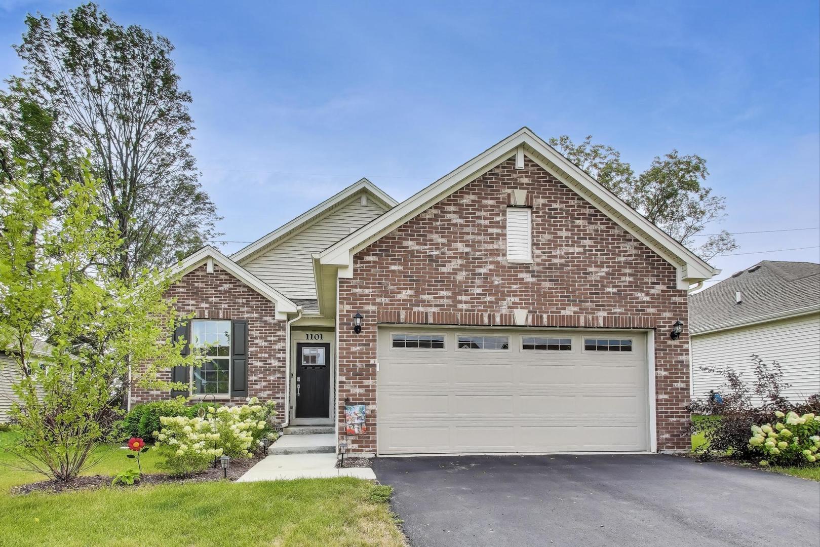 1101 Black Cherry Drive Crystal Lake, IL 60012 - Photo 1 of 2 a view of a house with a garden