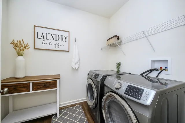 a view of storage and utility room with washer and dryer