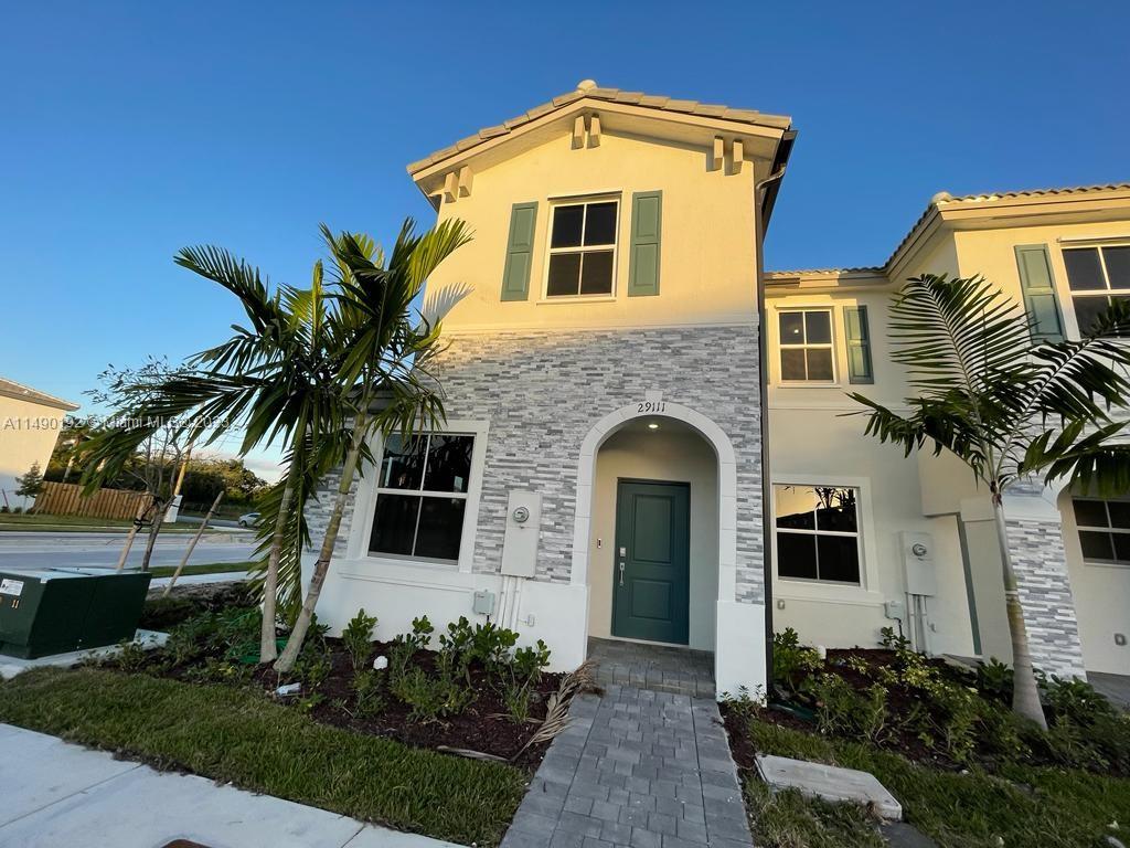 29111 Southwest 162th Court Homestead, FL 33033 - Photo 1 of 15 a front view of a house with a yard