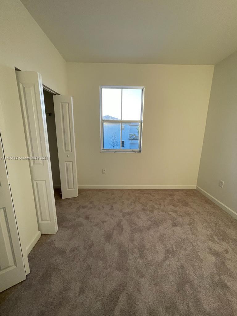 29111 Southwest 162th Court Homestead, FL 33033 - Photo 12 of 15 an empty room with windows
