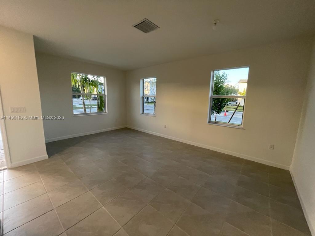 29111 Southwest 162th Court Homestead, FL 33033 - Photo 13 of 15 an empty room with windows