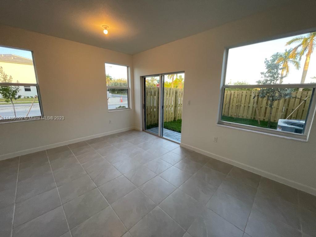 29111 Southwest 162th Court Homestead, FL 33033 - Photo 5 of 15 a view of an empty room with a window