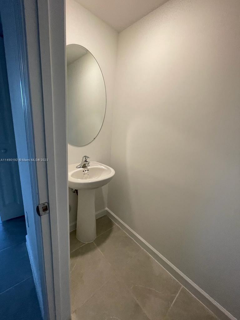29111 Southwest 162th Court Homestead, FL 33033 - Photo 6 of 15 a bathroom with a sink and a mirror