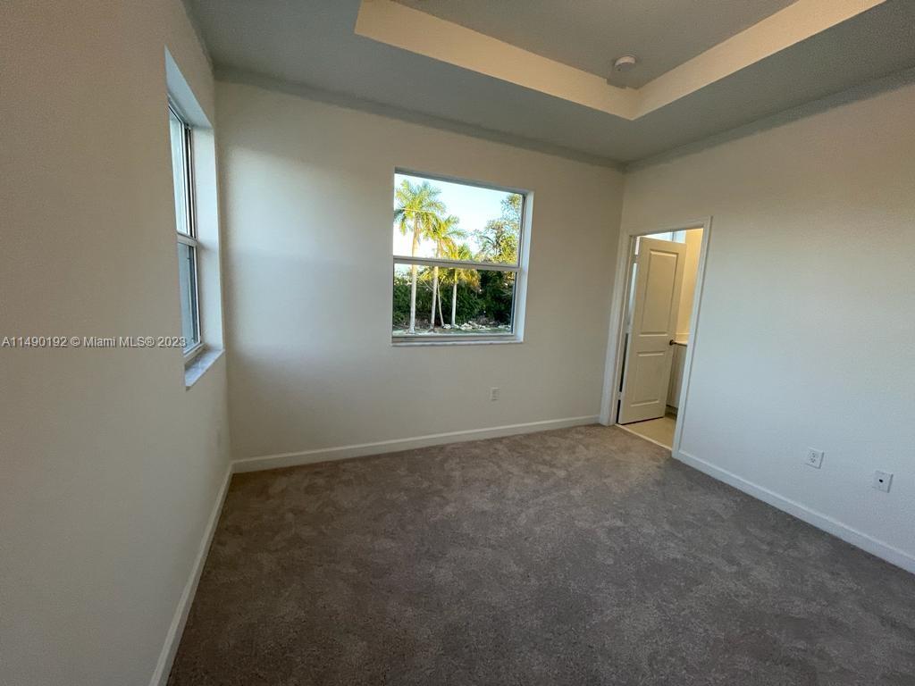 29111 Southwest 162th Court Homestead, FL 33033 - Photo 7 of 15 an empty room with windows