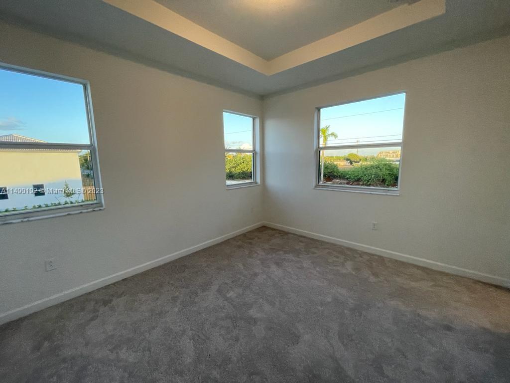 29111 Southwest 162th Court Homestead, FL 33033 - Photo 8 of 15 an empty room with windows
