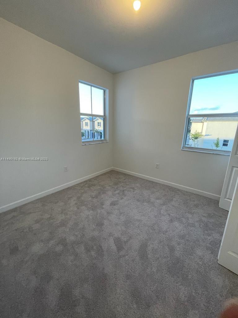 29111 Southwest 162th Court Homestead, FL 33033 - Photo 10 of 15 an empty room with a window