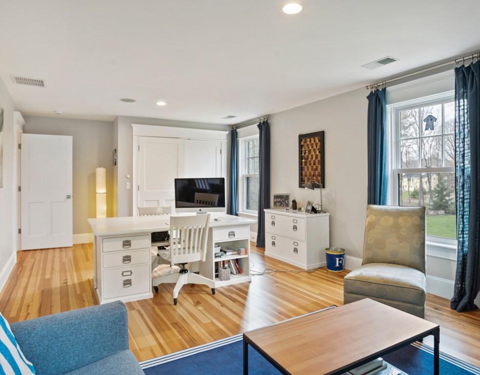 78 Nashoba Road Concord, MA 01742 - Photo 23 of 39 a living room with furniture and a flat screen tv