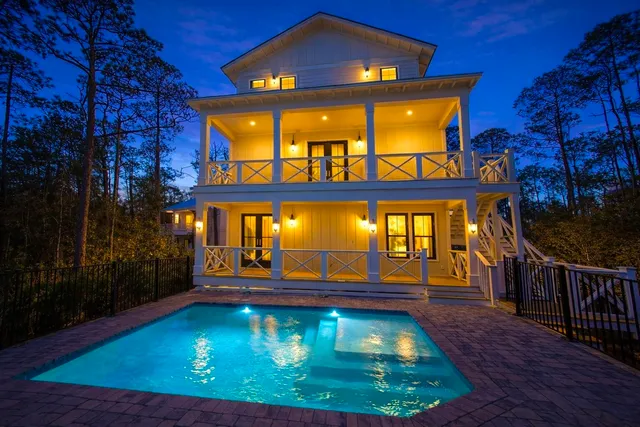 swimming pool view with a garden space
