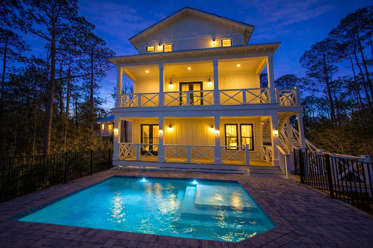 swimming pool view with a garden space
