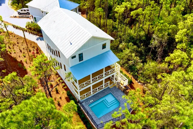 a view of a swimming pool with an outdoor seating