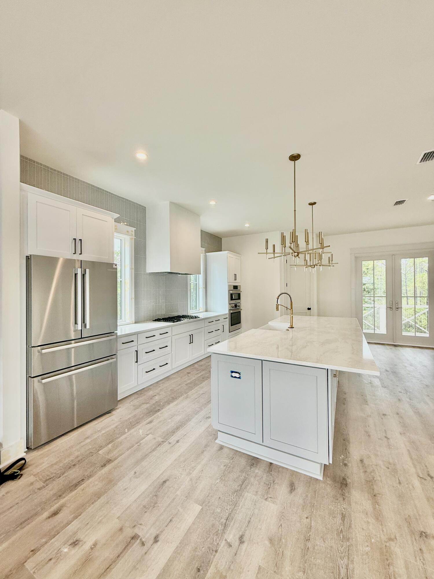 Lot 45 Sweet Gum Inlet Beach Inlet Beach, FL 32461 - Photo 18 of 56 a large white kitchen with cabinets