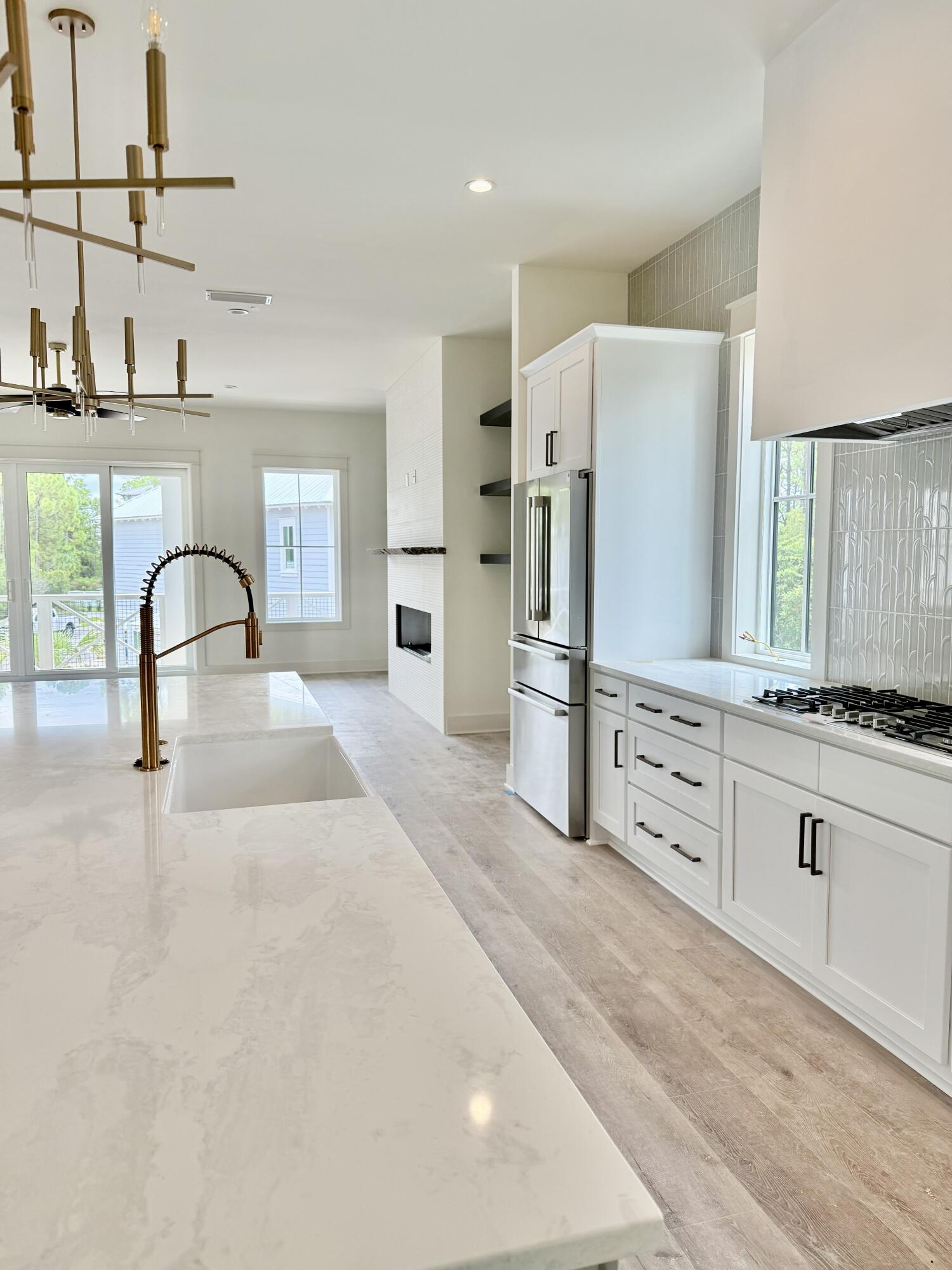 Lot 45 Sweet Gum Inlet Beach Inlet Beach, FL 32461 - Photo 19 of 56 a kitchen with stainless steel appliances kitchen island a refrigerator sink and cabinets