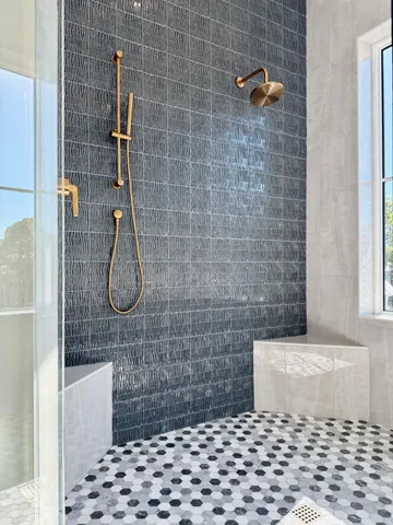 a bedroom with a large bed and a large window