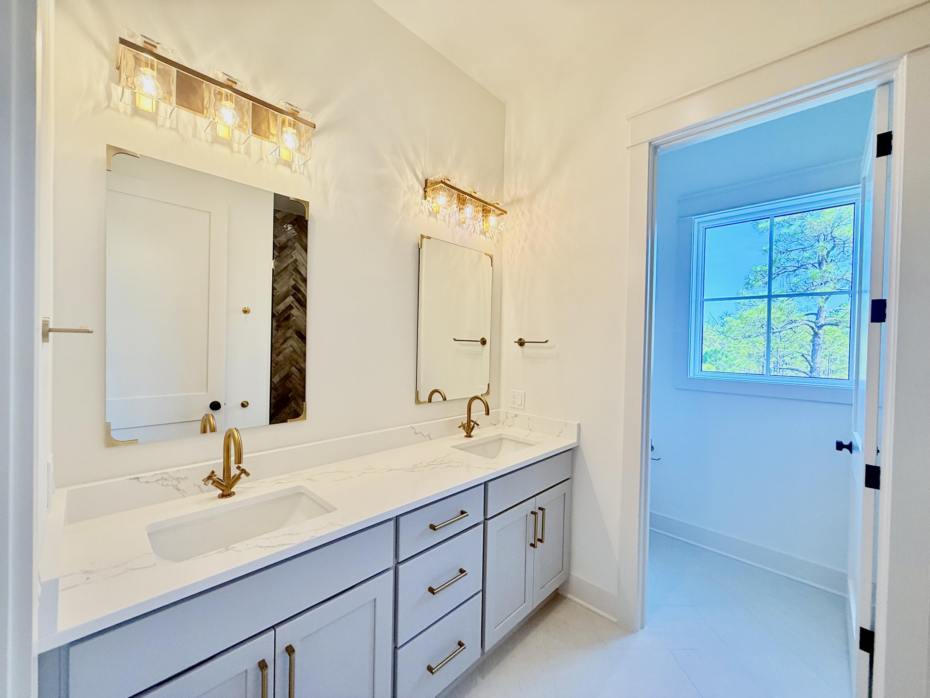 Lot 45 Sweet Gum Inlet Beach Inlet Beach, FL 32461 - Photo 40 of 56 a bathroom with a double vanity sink a mirror and shower