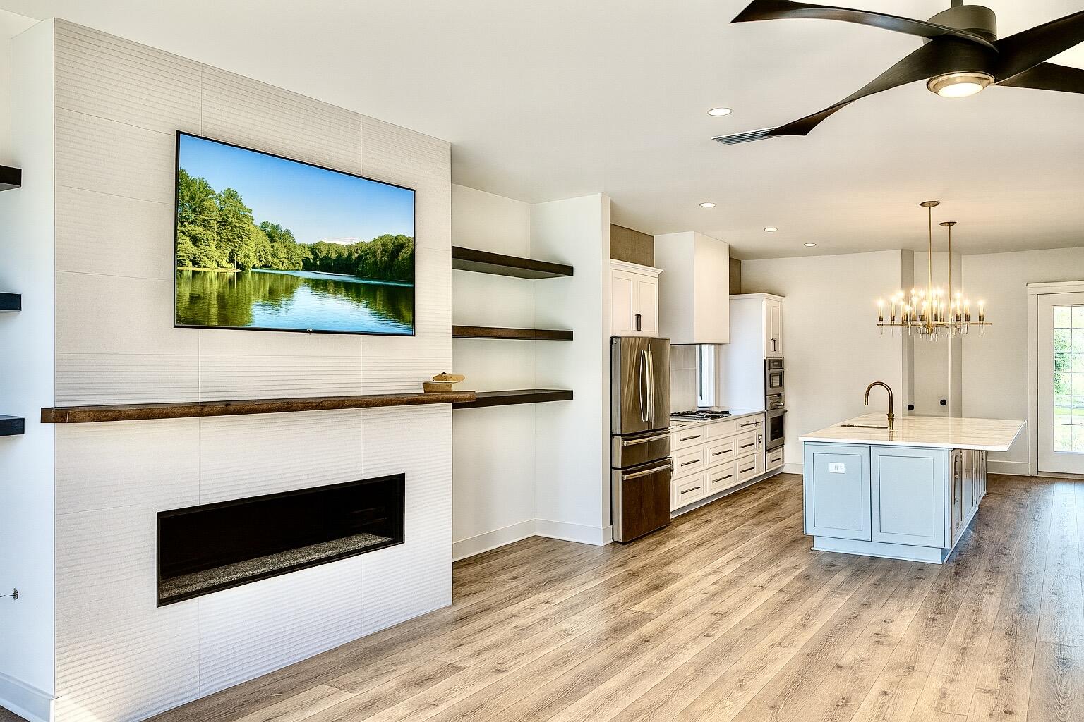 Lot 45 Sweet Gum Inlet Beach Inlet Beach, FL 32461 - Photo 4 of 56 a living room with stainless steel appliances kitchen island granite countertop a stove and a fireplace