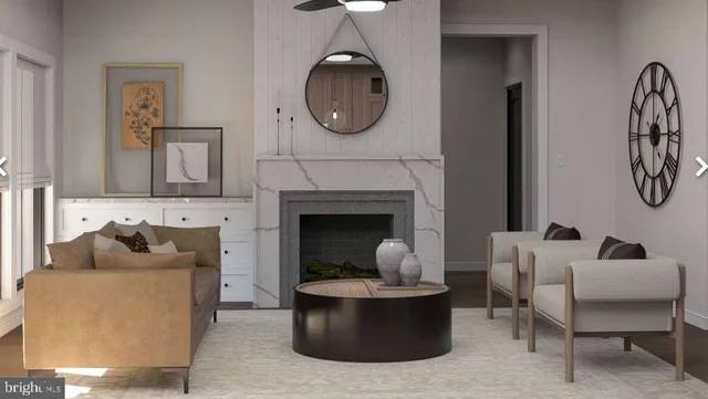 a living room with furniture and a fireplace