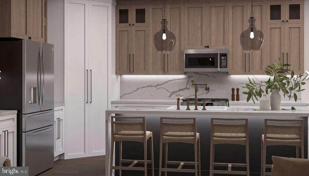 Lutz Road Stewartstown, PA 17363 - Photo 5 of 10 a kitchen with stainless steel appliances a sink and cabinets