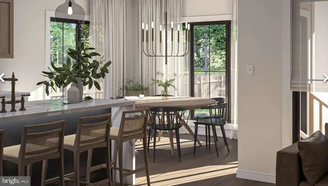 a dining room with furniture window and wooden floor