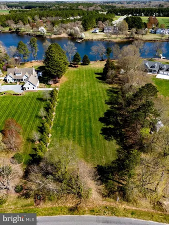 a backyard of a house with a lake view