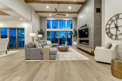 a living room with fireplace furniture and a flat screen tv