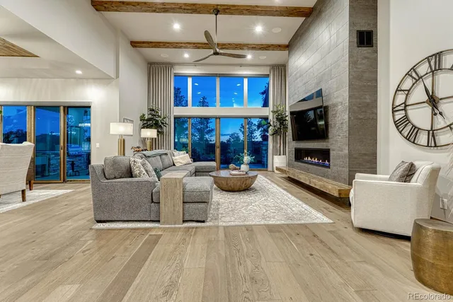 a living room with fireplace furniture and a flat screen tv
