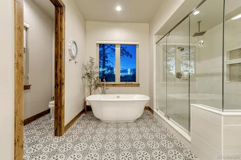 a bathroom with a bathtub and shower