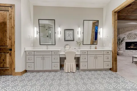 a spacious bathroom with a granite countertop sink mirror and a