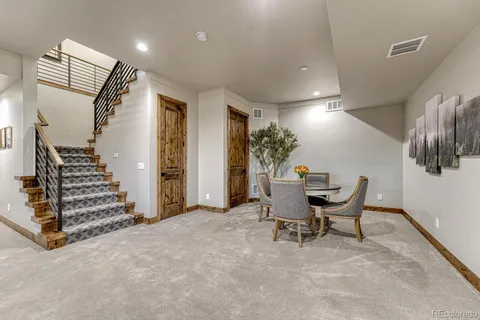 a view of a livingroom with furniture and stairs