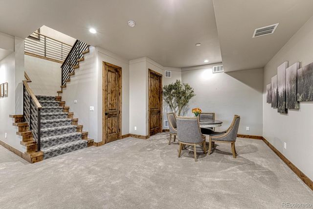 a view of a livingroom with furniture and stairs