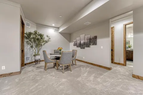 a view of a livingroom with furniture and a potted plant