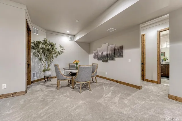 a view of a livingroom with furniture and a potted plant