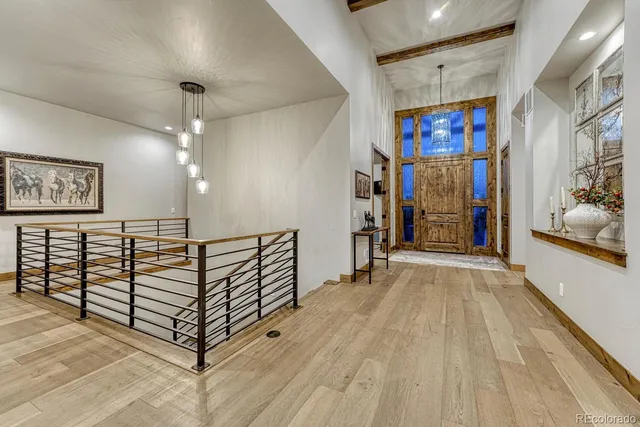 a view of a hallway with stairs