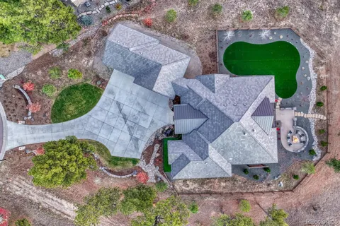 an aerial view of a house with outdoor space