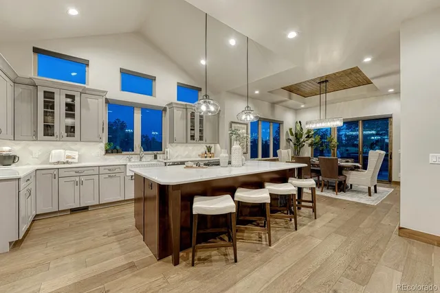 a large kitchen with a table and chairs in it